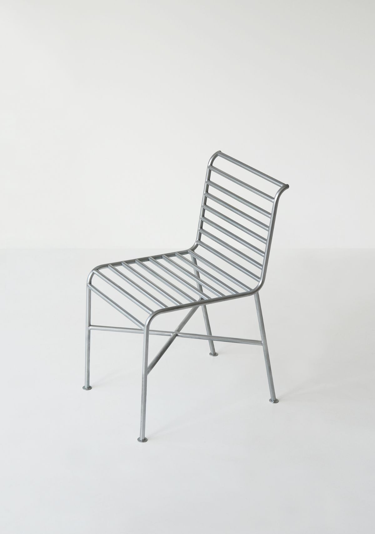 Garden Chair by Jungmo Yang — A tubular steel chair photographed in frontal view against a neutral background.