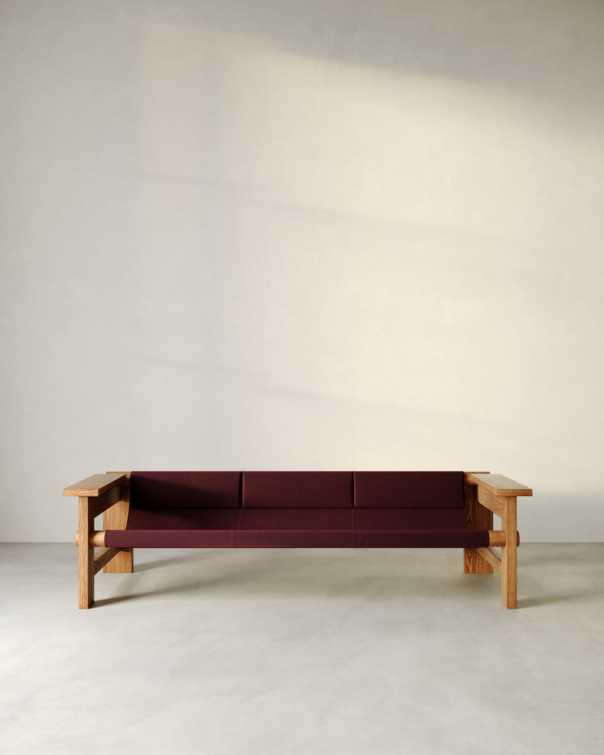 Furniture Collection by HAOS — A three-seat sofa by HAOS features a substantial wooden frame of light oak with exposed mortise-and-tenon joinery at corner intersections and diagonal...
