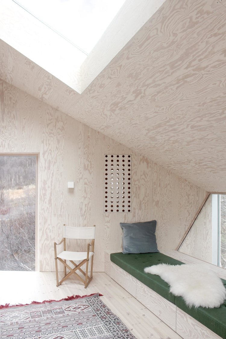 Røldal Cabin by Reiulf Ramstad Arkitekter — Interior view of the Røldal Cabin's compact bedroom volume, demonstrating the deliberate material and spatial contrasts of the design.