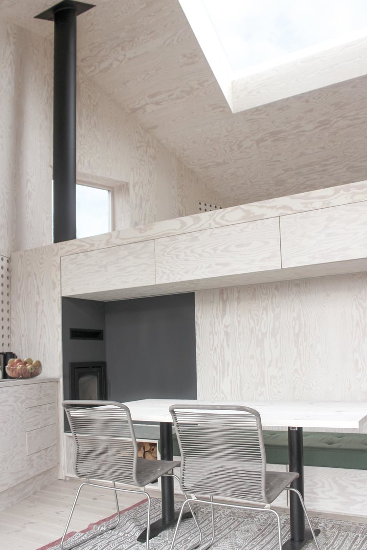 Røldal Cabin by Reiulf Ramstad Arkitekter — Interior view of the Røldal Cabin's upper volume, revealing the spatial relationship between two levels.