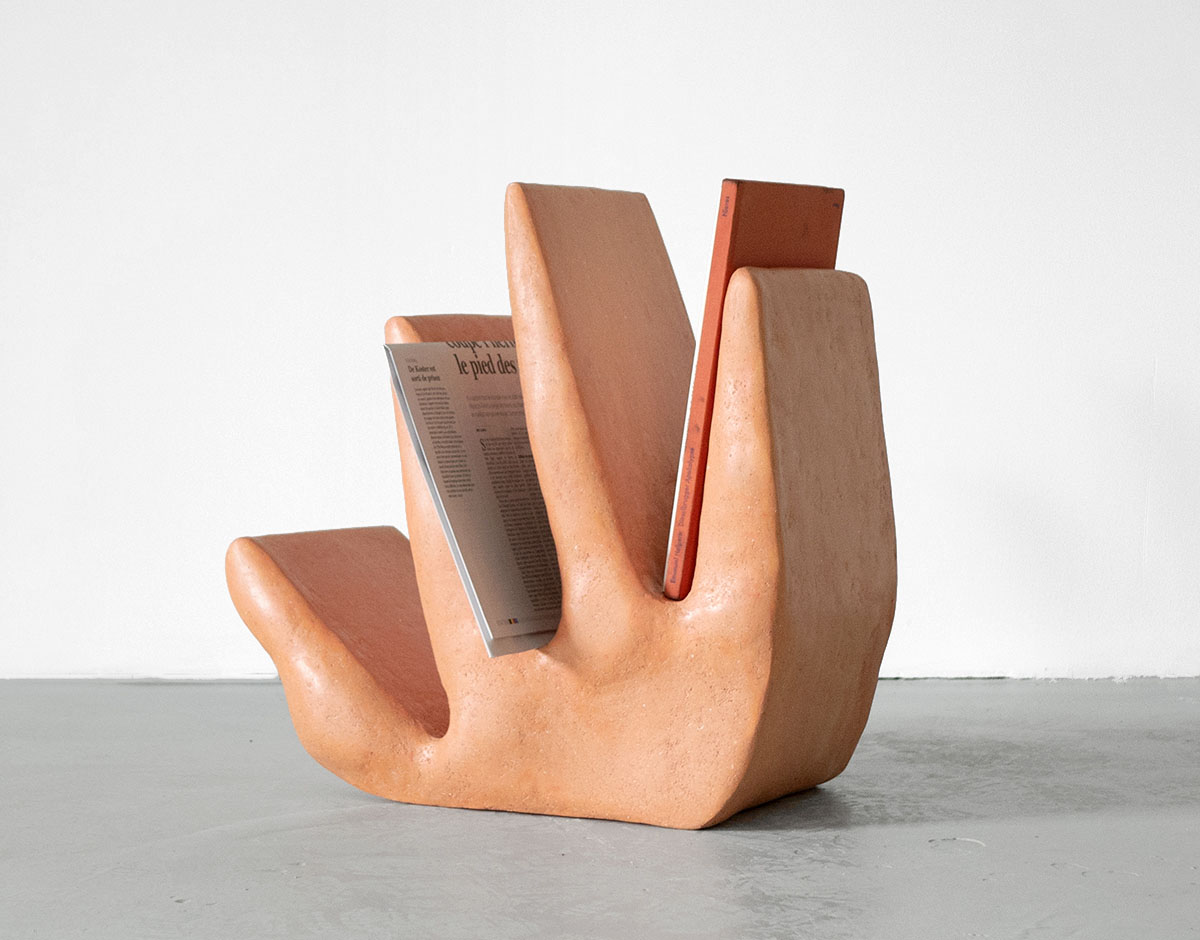 Roommates by Barbora Žilinskaite — Hand-sculpted terracotta vessel with anthropomorphic qualities, featuring a broad torso tapering to four columnar legs that suggest bodily presence.
