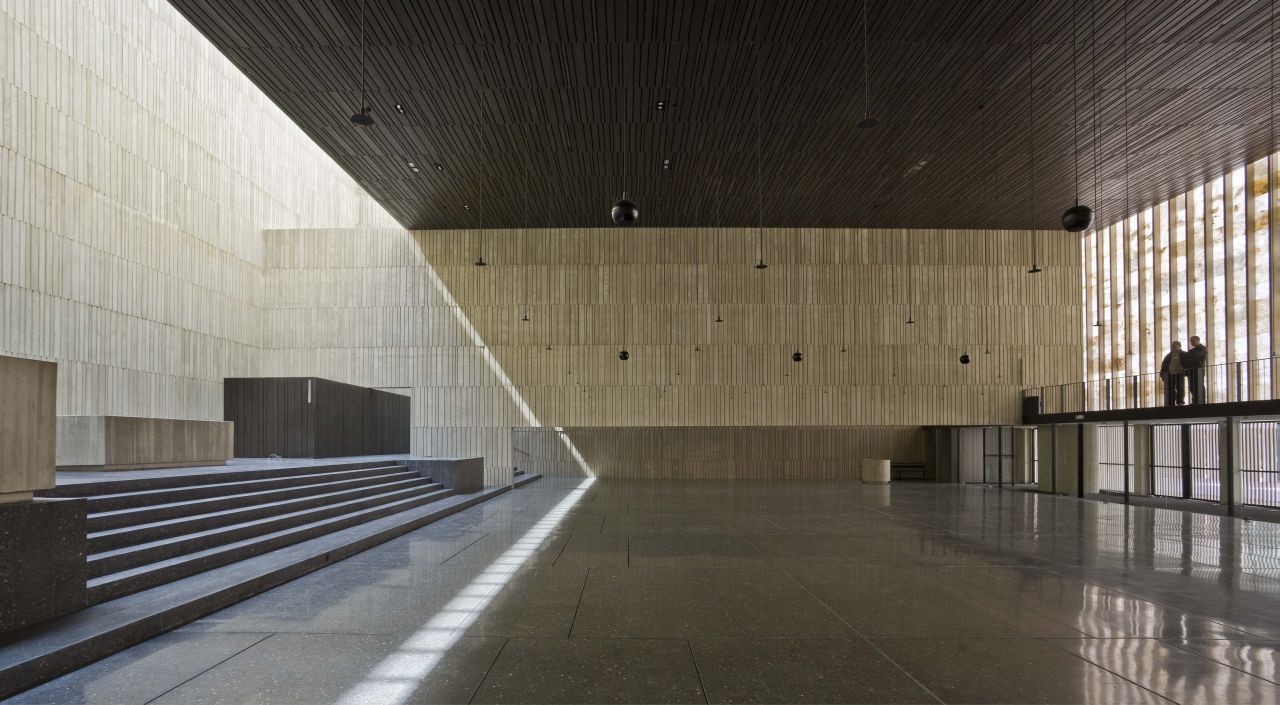 San Jorge Church by Tabuenca & Leache — A rendered interior view of San Jorge Church's main hall, captured from a low vantage point near ground level.