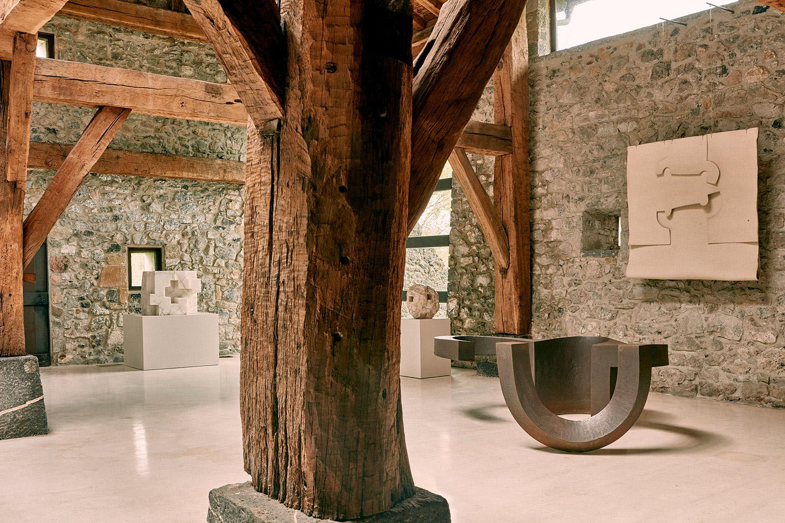Eduardo Chillida Leku Museum — The museum's interior demonstrates post-and-beam timber construction within stone-walled volumes.