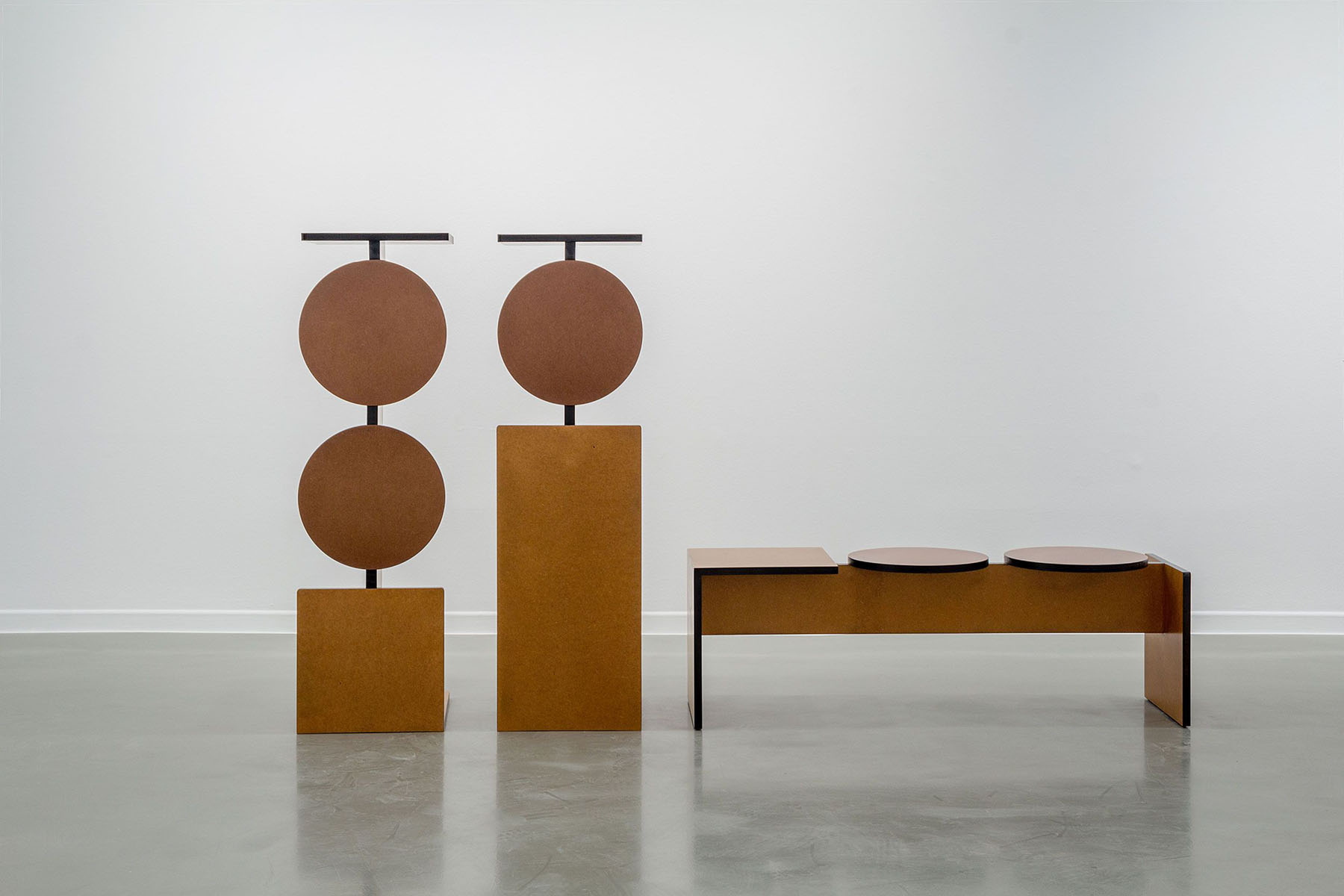 Entreplanta by Marta Ayala Herrera and Cito Ballesta — Entreplanta collection furniture ensemble arranged in a gallery setting on polished concrete.