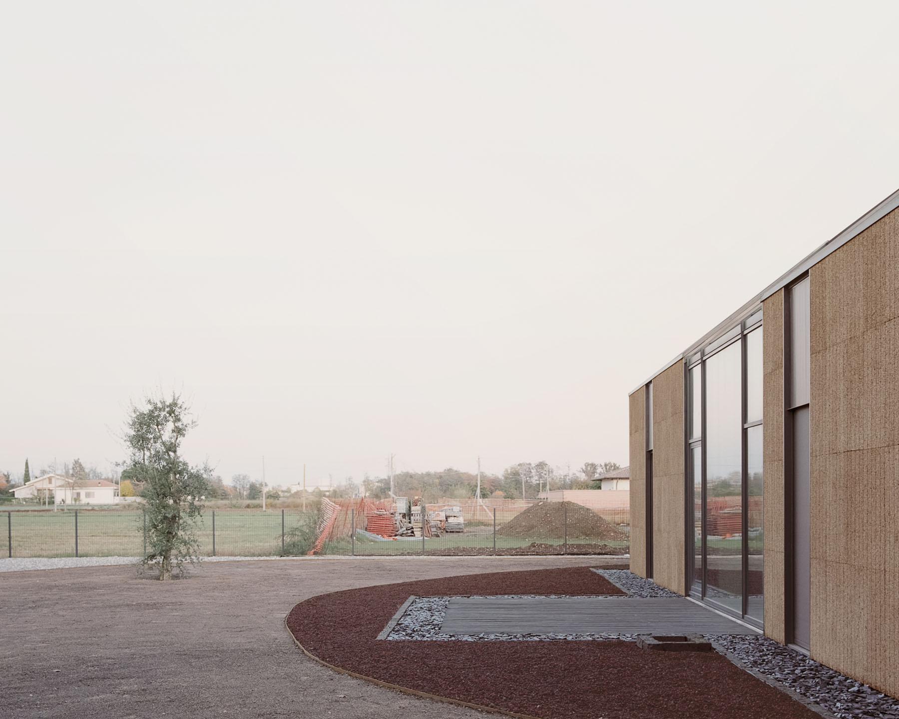 Casa Quattro by LCA Architetti — Casa Quattro's eastern elevation anchors the landscape threshold between cultivated grounds and rural hinterland.