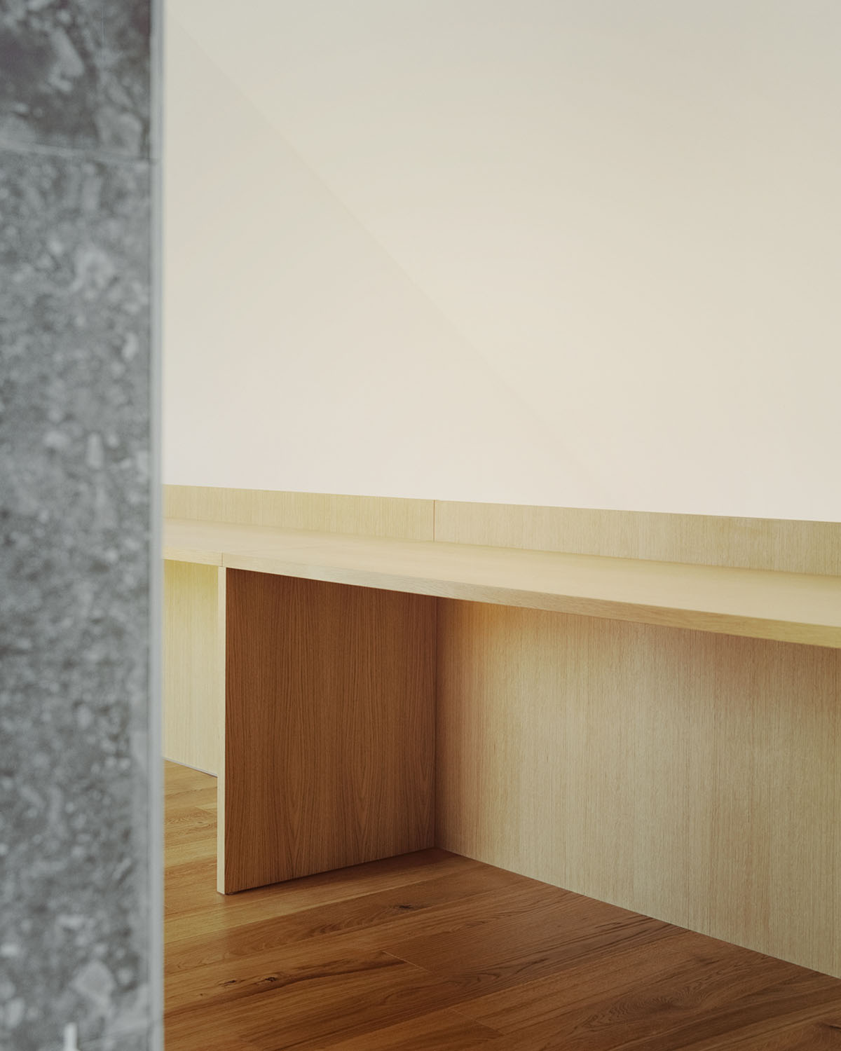 Casa Quattro by LCA Architetti — An interior threshold framed by a textured grey concrete column on the left.