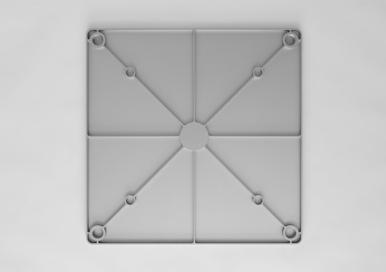 Una Table by Mario Martinez — Overhead view of Una Table's cast aluminum tabletop reveals its geometric complexity.