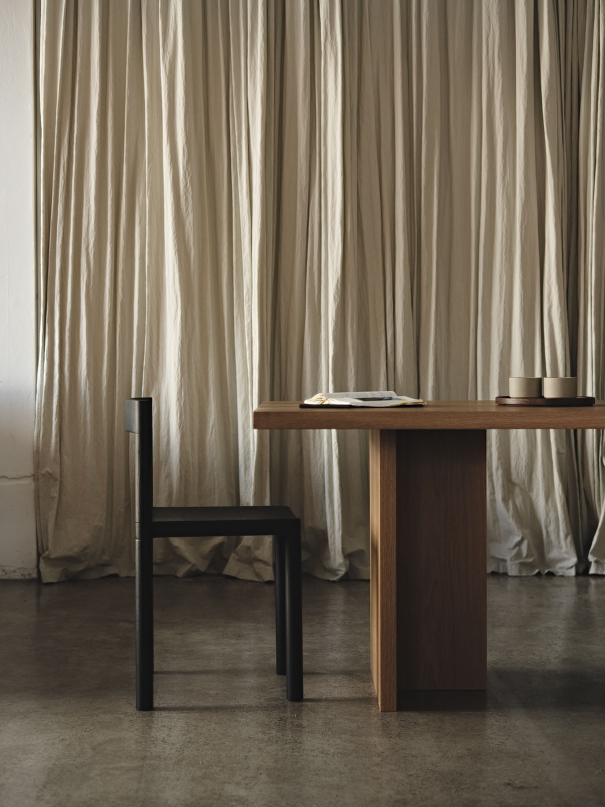 Pier Chair by Leonard Kadid — Pier Chair by Leonard Kadid positioned at a wooden table in a Paris studio, demonstrating joinery construction.