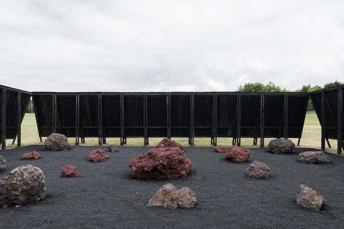 Inbetween Pavilion by Pontoatelier — The Inbetween Pavilion frames a volcanic landscape through its opposing peaked timber planes.