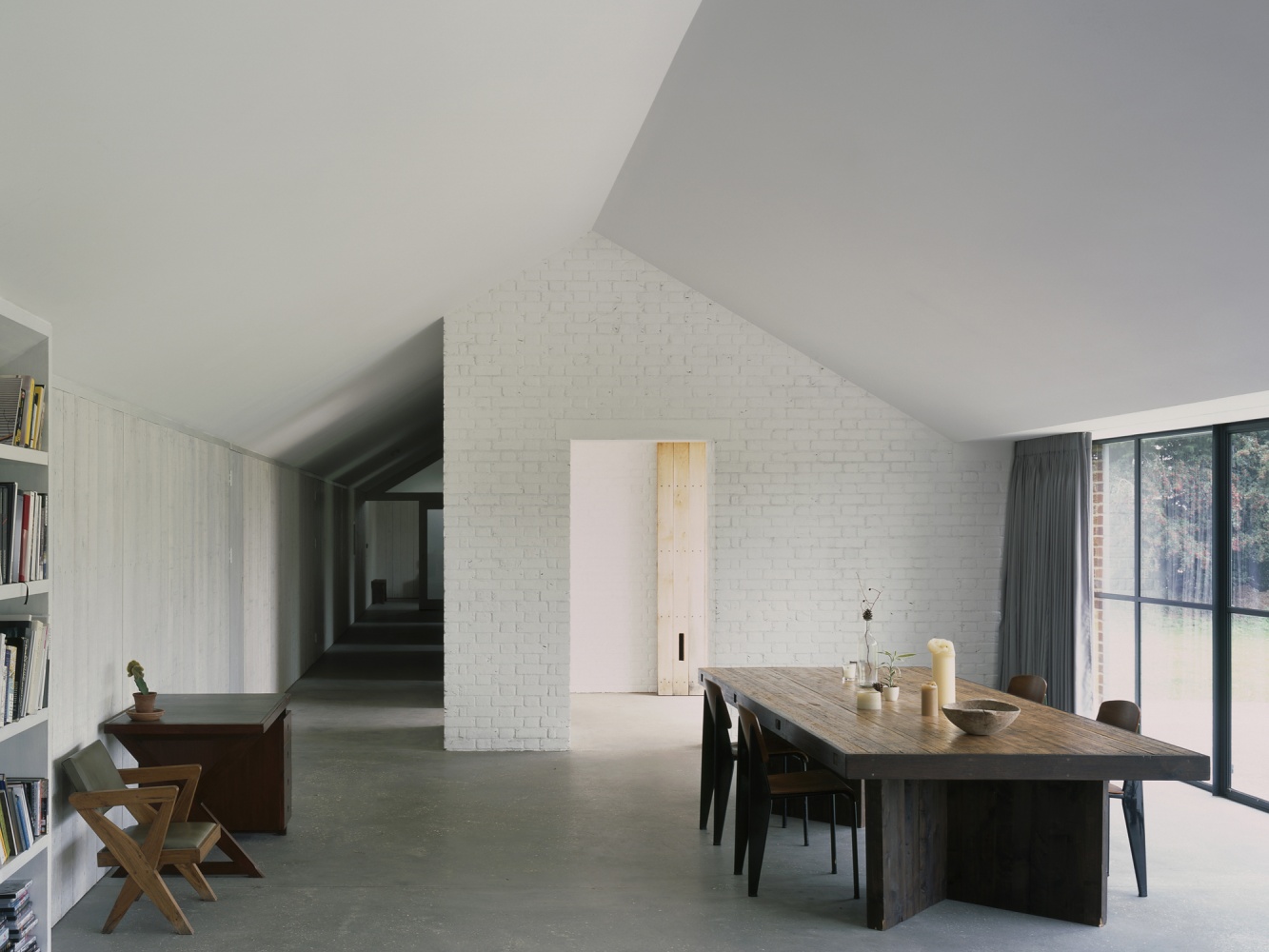 Stable Acre House by David Kohn — The dining pavilion interior reveals the house's material hierarchy and spatial generosity.