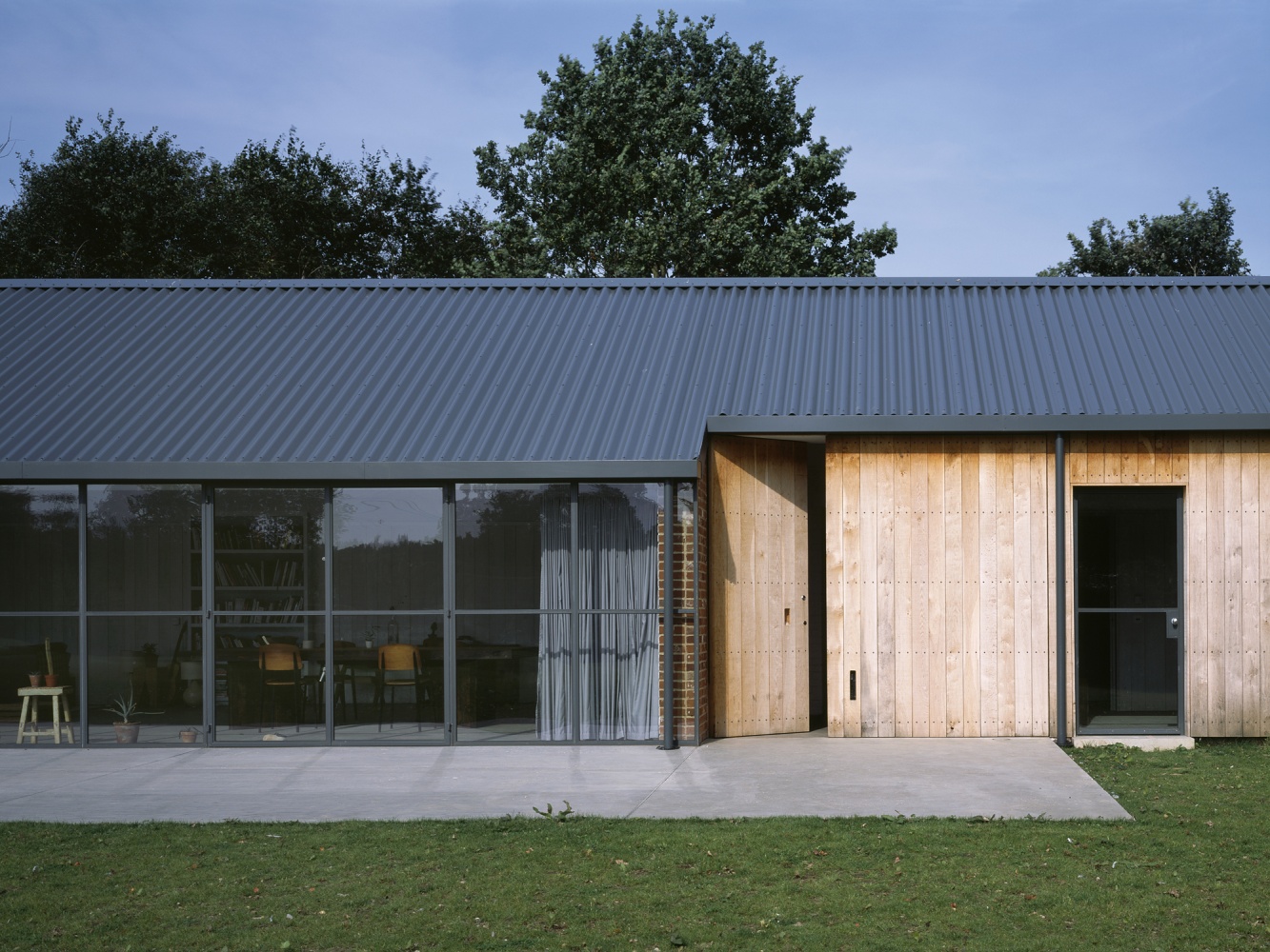 Stable Acre House by David Kohn — The south-west elevation of Stable Acre presents a composed facade of distinct material zones.