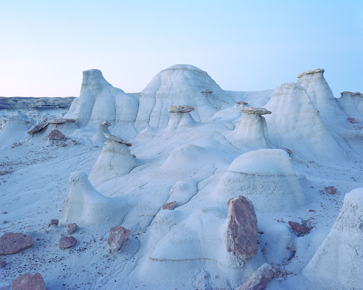 Breathtaking Landscapes by Luca Tombolini — Hoodoo formations rise from a snow-blanketed basin in this large-format landscape study.