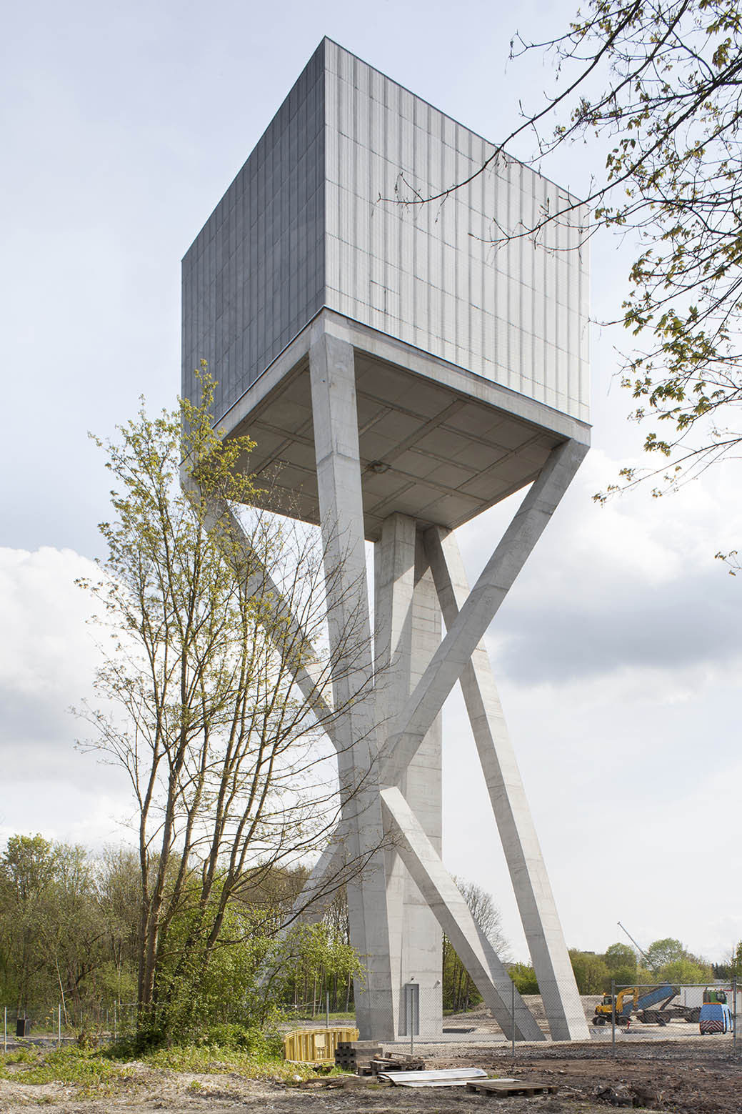Water Tower by V+ — V+'s water tower subverts the traditional vertical monolith through radical formal inversion.