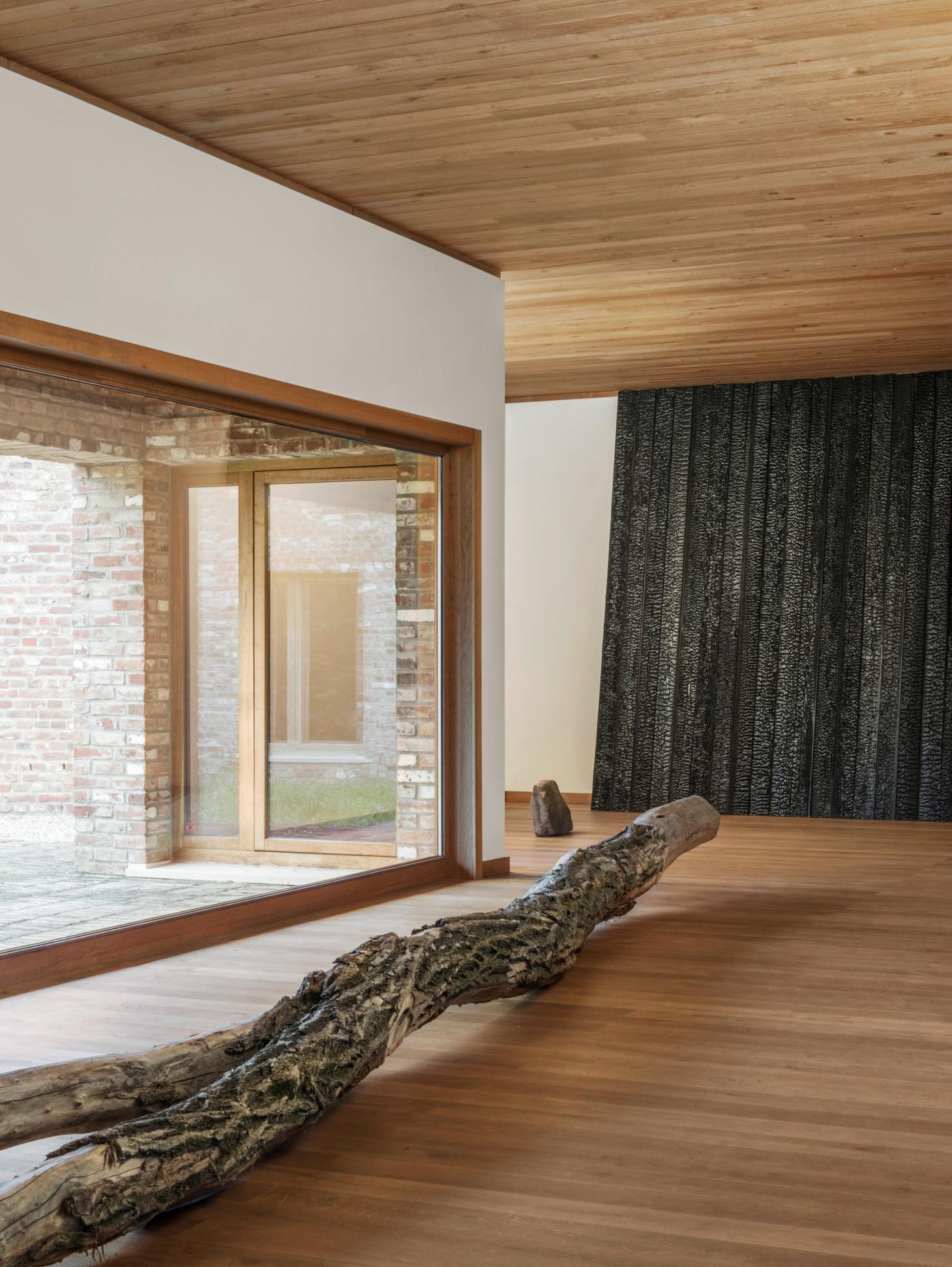 Ein Stein Tea House and Other Architectures by Terunobu Fujimori — Interior view of the Ein Stein Tea House revealing the post-and-beam timber construction and material palette.