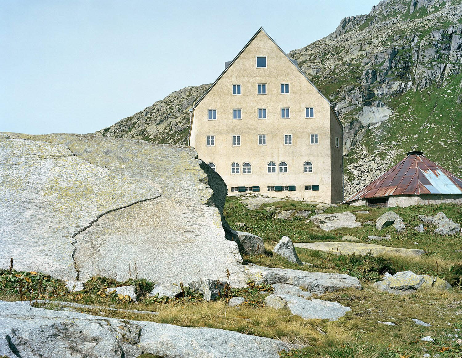 Old hospice, St. Gotthard Pass by Miller & Maranta — The hospice presents a austere geometric form against the rocky alpine terrain.