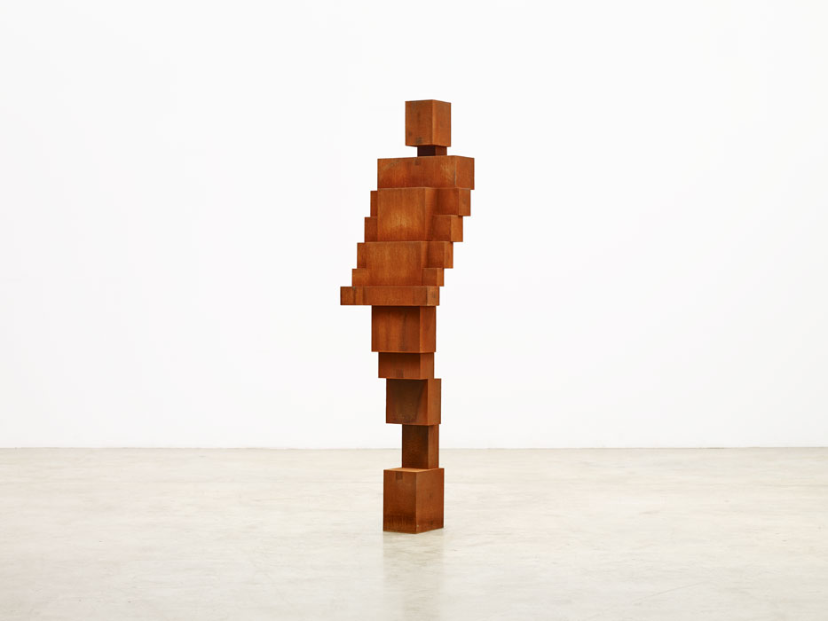 Sculptures by Antony Gormley — Antony Gormley's timber sculpture presents a vertically stacked figure constructed from rectangular wooden blocks of graduated sizes.