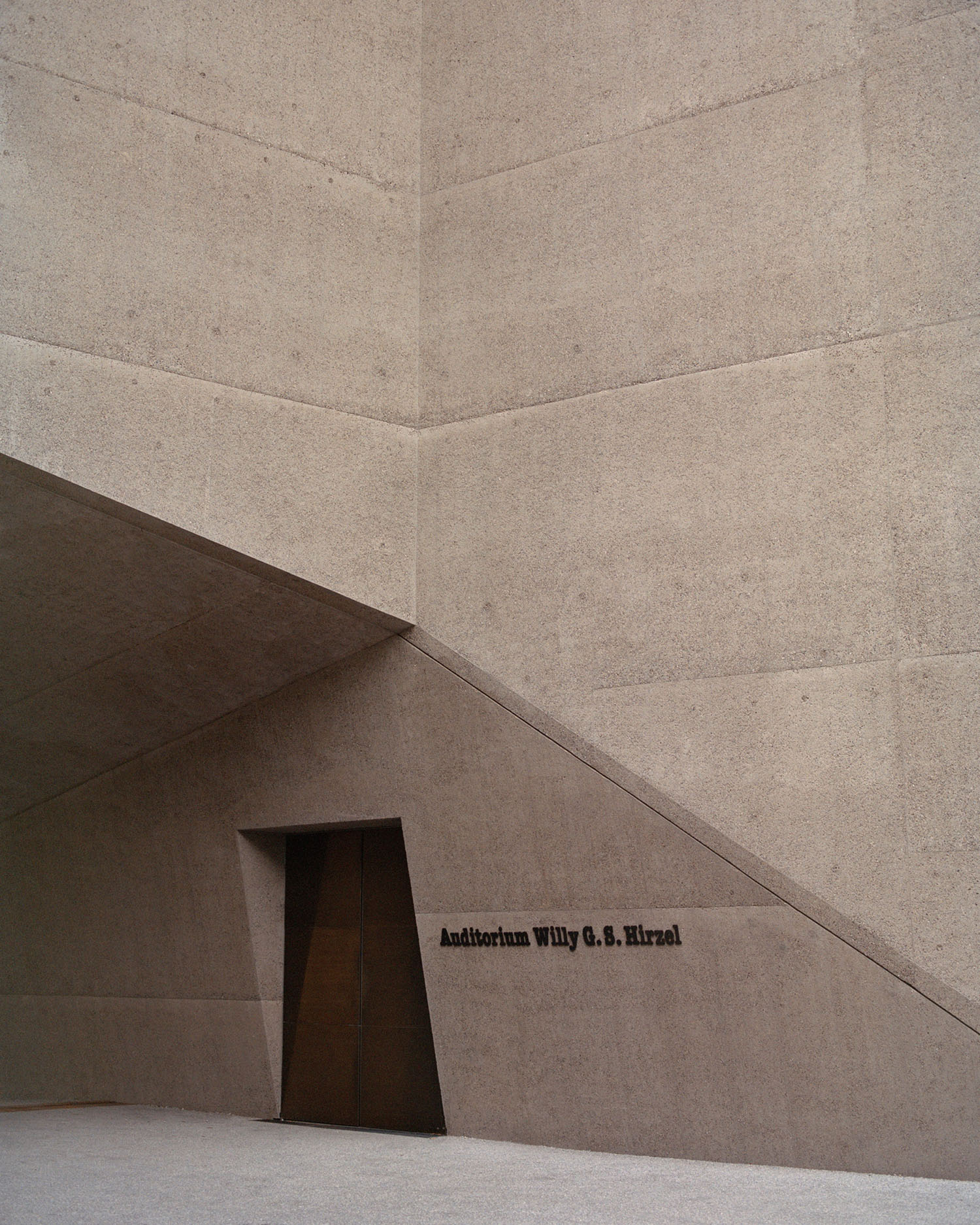 Swiss National Museum by Christ & Gantenbein photographed by Rory Gardiner — A low-angle view of the Swiss National Museum's new wing reveals the geometric precision of its cream-colored concrete facade.