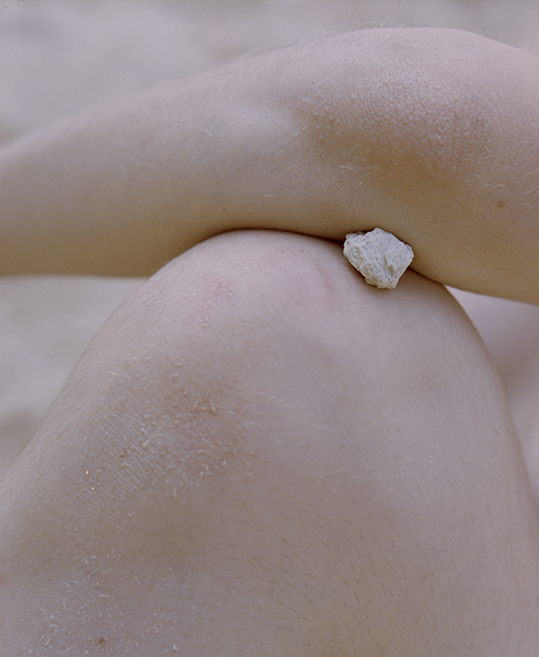 Selected works by András Ladocsi — A close-up photograph isolating a single moment of bodily contact with water.
