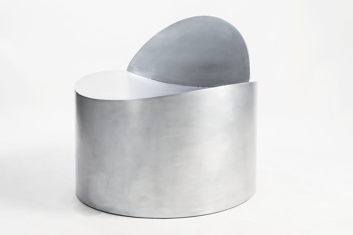 Rolled Chair by Jonathan Nesci — The Rolled Chair by Jonathan Nesci presents a cylindrical aluminum body with a hemispherical dome top in brushed metal finish.