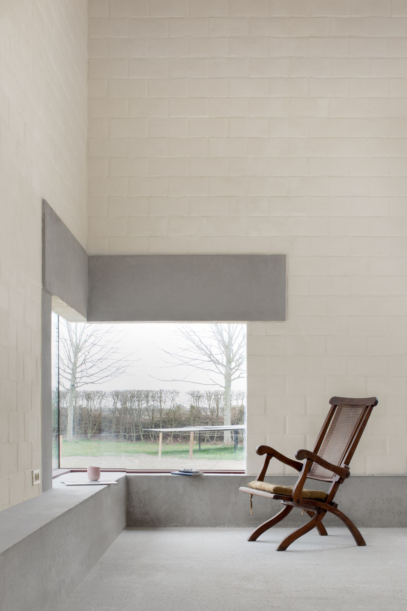 Studio SDS by GRAUX & BAEYENS — A studio interior defined by material contrasts and framed views.
