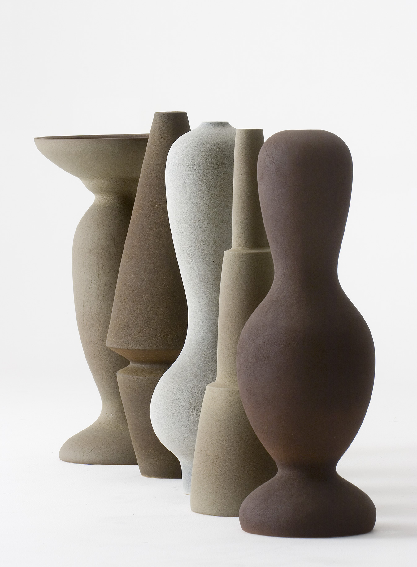 Selected works by Turi Heisselberg Pedersen — Five hand-formed ceramic vessels arranged in a clustered group shot against a white background.