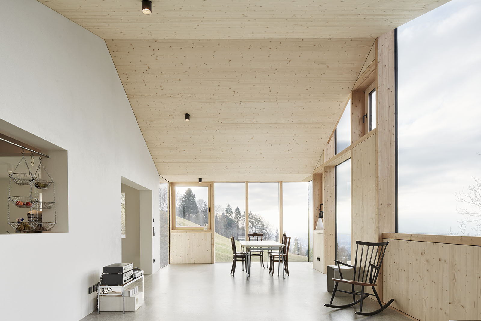 House Hohlen by Jochen Specht — Interior view of the House Hohlen revealing the spatial generosity enabled by its gable-roof structure.