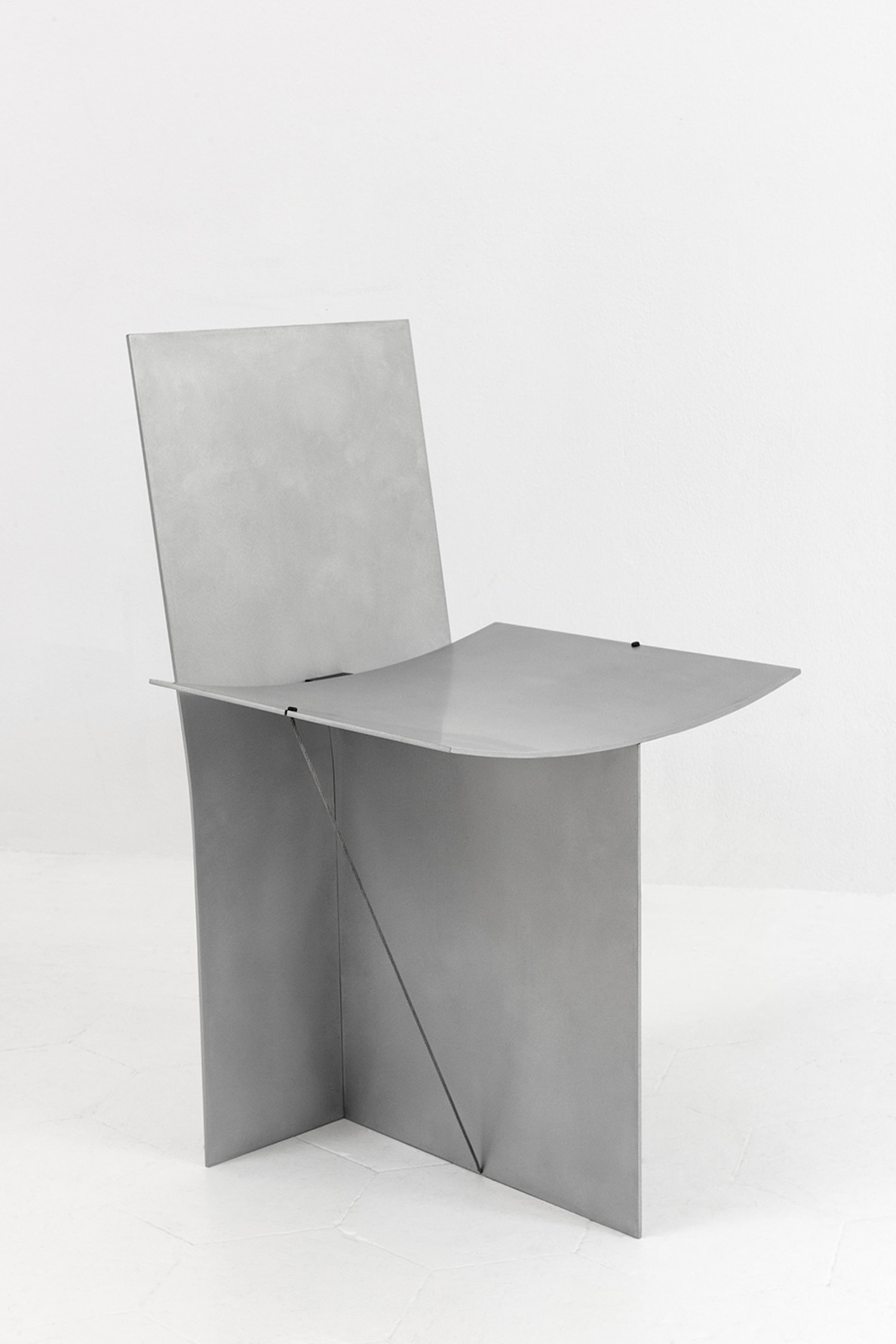 Equilibrium Chair by Guglielmo Poletti — The Equilibrium Chair by Guglielmo Poletti demonstrates structural minimalism through sanded aluminum construction with matte transparent coating.