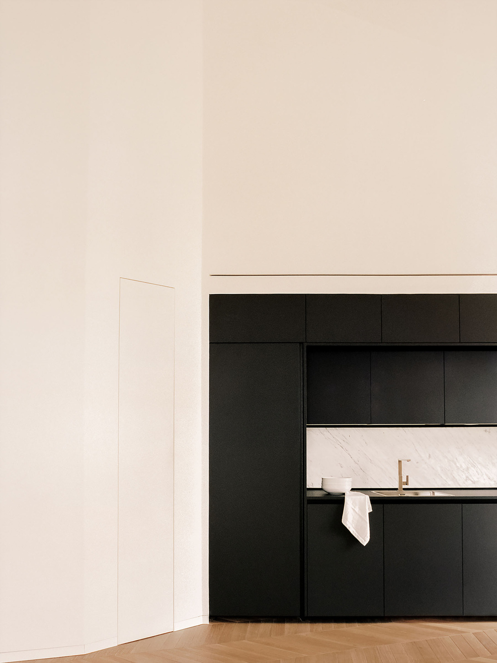 House for a Couple by SET Architects — A kitchen interior defined by chromatic contrast and material precision.