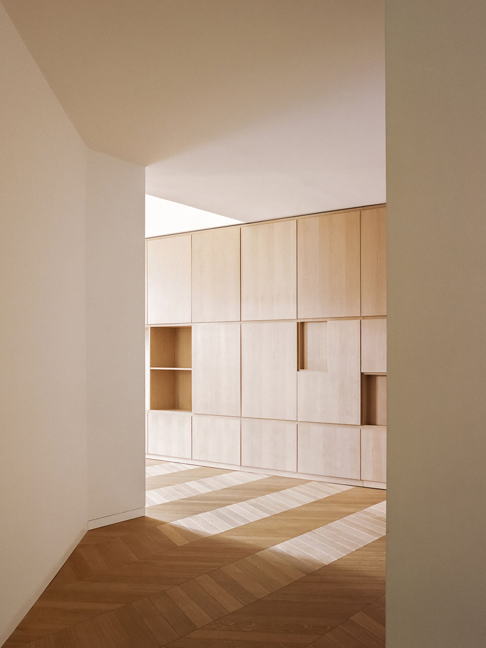 House for a Couple by SET Architects — A passage framed by white paneled double doors opens into a renovated apartment in Fondi's historic center.