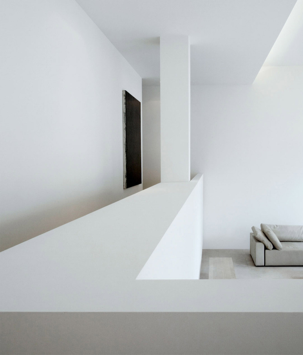 Alkema Studio by Jen Alkema Architect — A mezzanine level opens onto a lower living area through a dramatic vertical threshold.