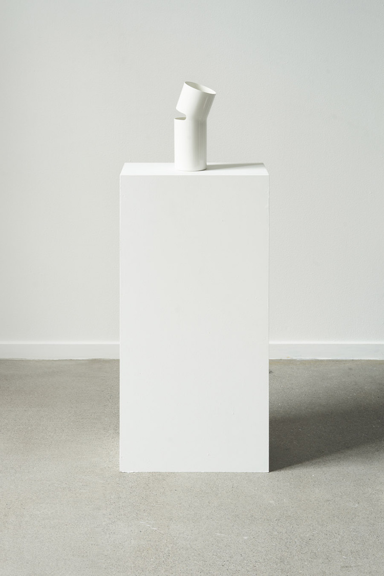 Unika Auction by Bjørn van den Berg and Falke Svatun — A white lacquered pedestal base supports a sculptural object comprising staggered horizontal planes in brushed stainless steel.