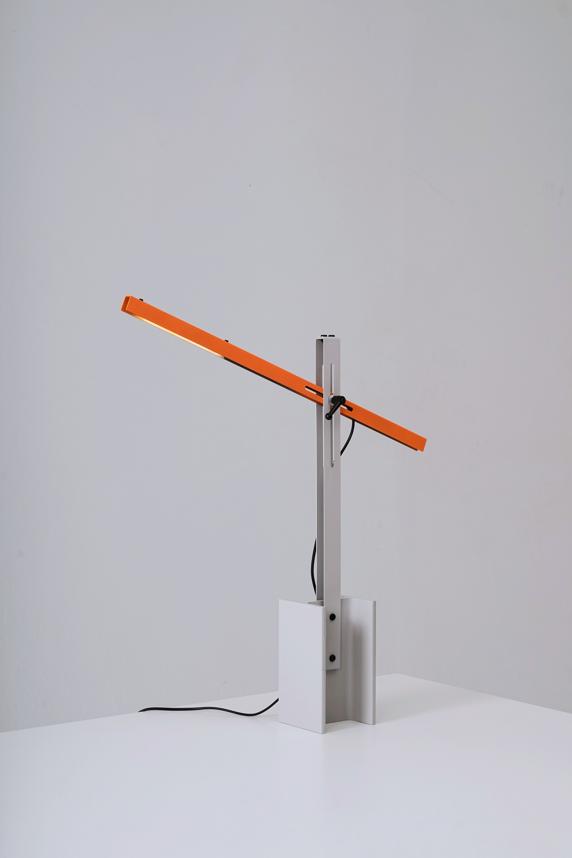 H-beam Lamp Series by SF-SO — H-beam lamp by SF-SO with rotating cylindrical lampshade in safety orange.