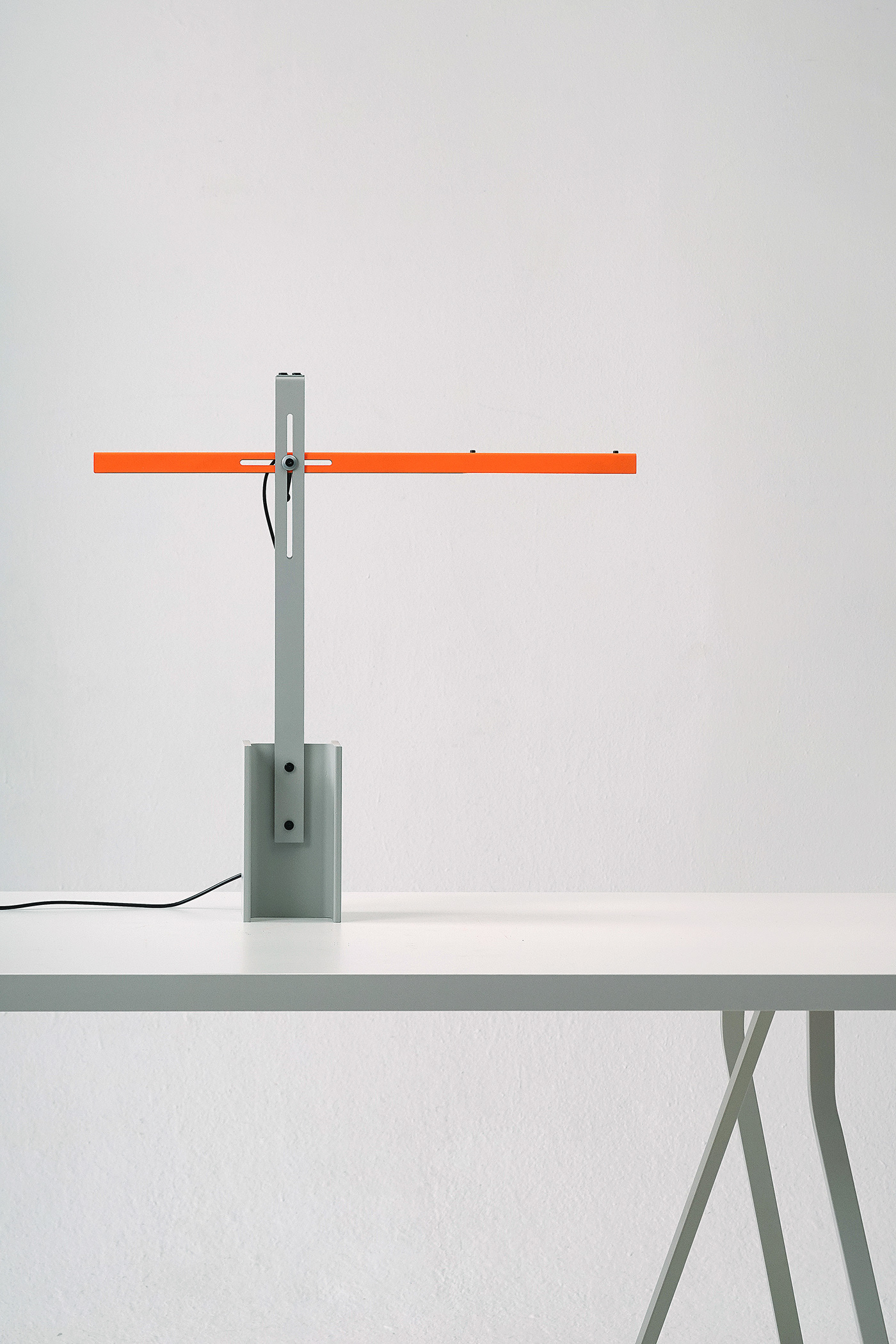 H-beam Lamp Series by SF-SO — A rotating table lamp from the H-beam series demonstrates functional minimalism through exposed metal joinery.