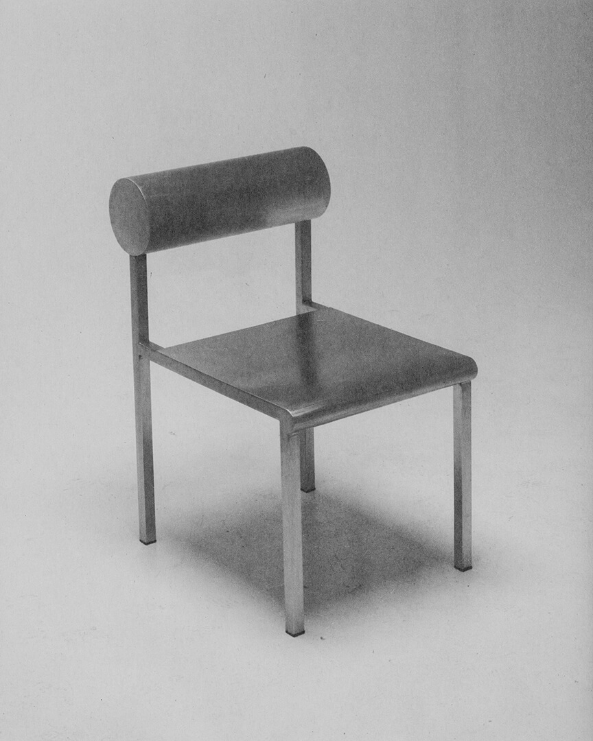 Waka Waka Collection by Shin Okuda by Alexander Zaxarov — A four-legged chair with welded steel frame construction, featuring a flat rectangular seat with sharp edges and a distinctive horizontal cylindrical...