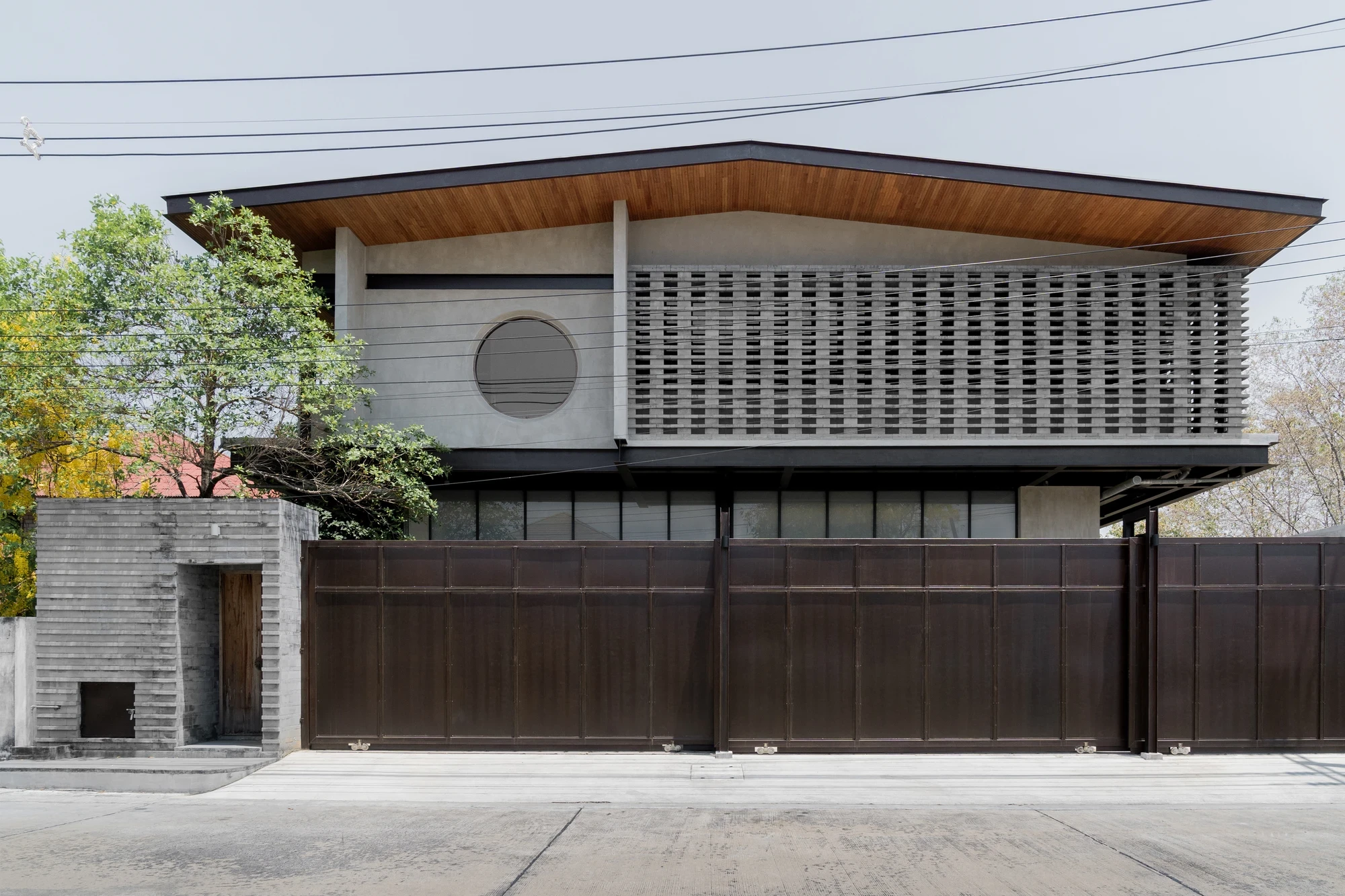 H168 House by Only Human, Bangkok Thailand, Chinese spatial traditions, dark grey brick, courtyard, moon gate