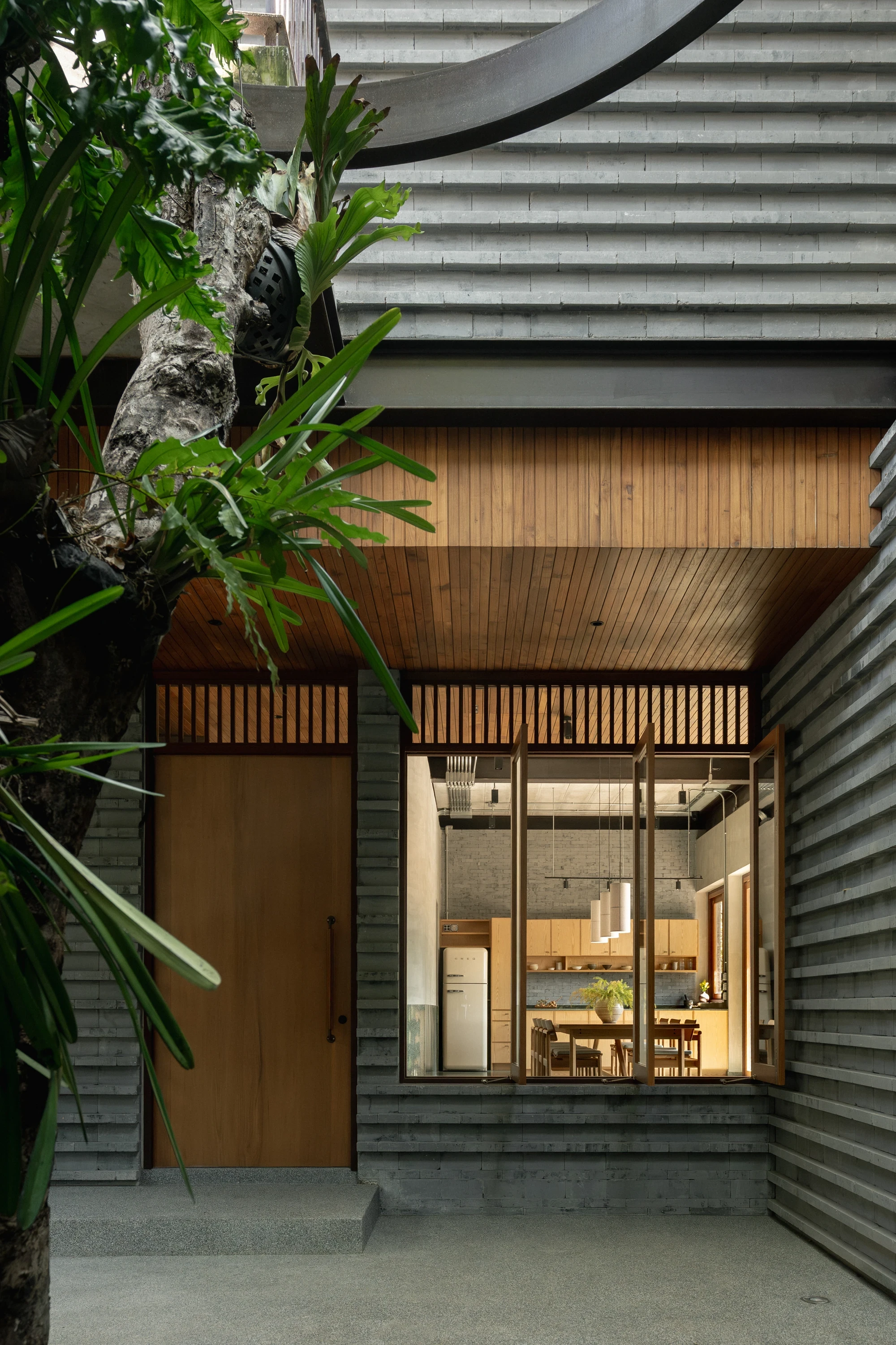 H168 House by Only Human, Bangkok Thailand, Chinese spatial traditions, dark grey brick, courtyard, moon gate