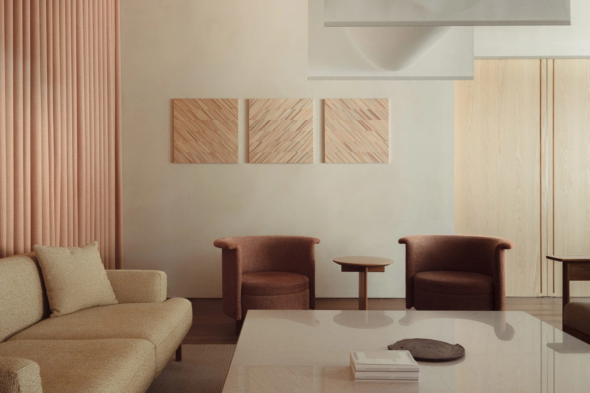 Loca Niru Restaurant by Keiji Ashizawa Design — A lounge seating area defined by material restraint and geometric clarity.