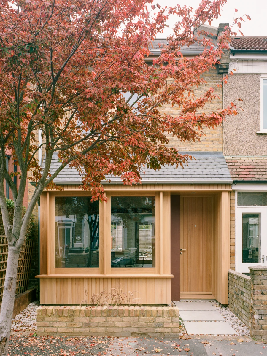 Walthamstow House by PSL — The timber-clad extension to the Victorian terraced house at 25 Brunswick Street presents a rectilinear intervention in natural wood tones, replacing the...