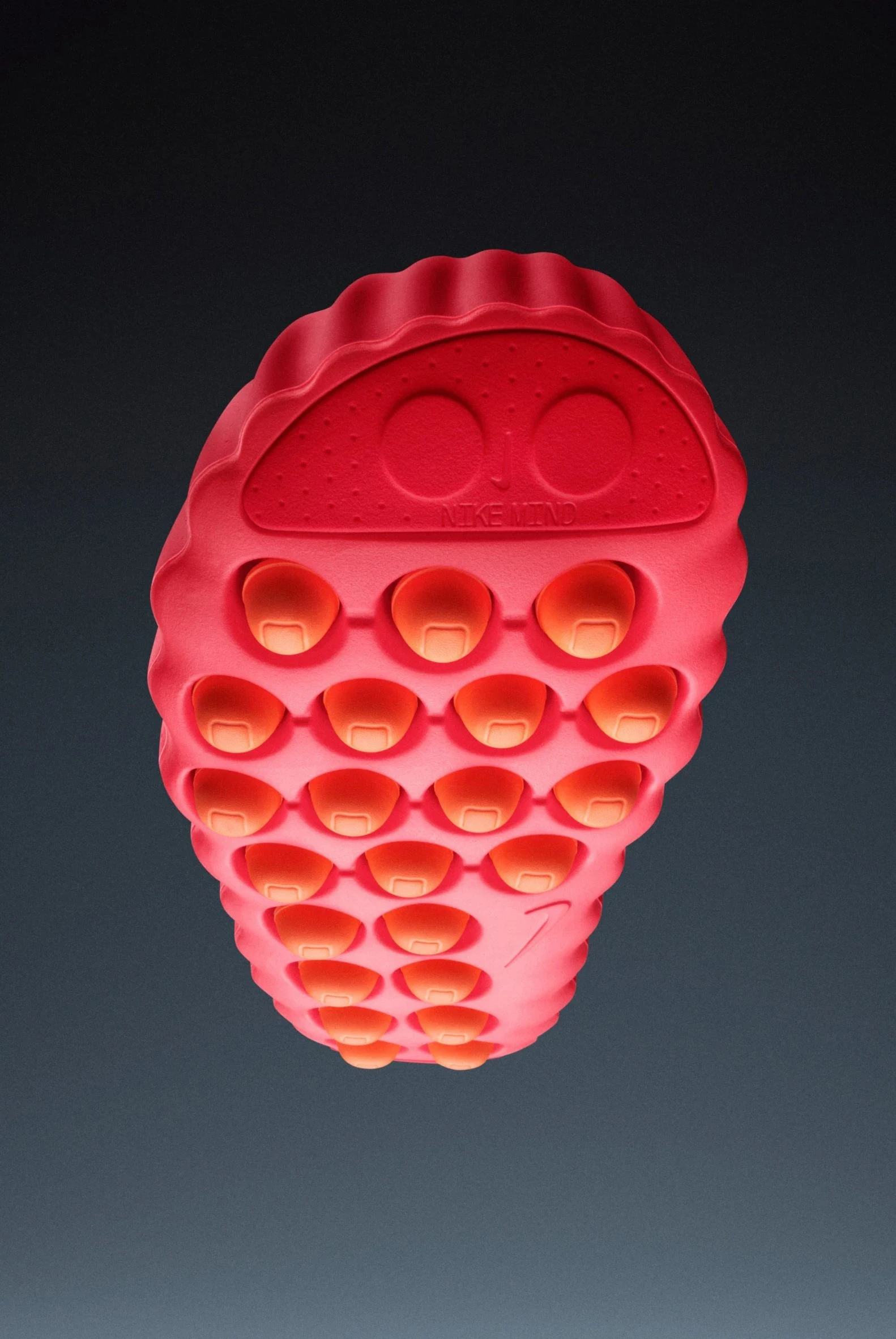 Nike Mind 001 + 002 — A neon-pink silicone pop-it fidget toy molded in the shape of a strawberry.