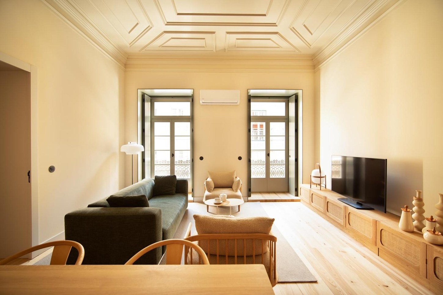 The Verse by João Luís Carrilho da Graça + Studio Astolfi — A serviced apartment living space organized as a compact residence, demonstrating the project's domestic-focused hospitality approach.