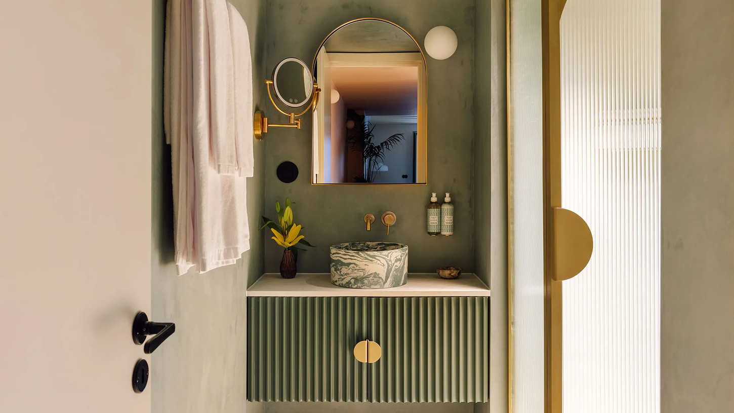 The Verse by João Luís Carrilho da Graça + Studio Astolfi — A compact bathroom vanity organised as a domestic wet room rather than hotel amenity.