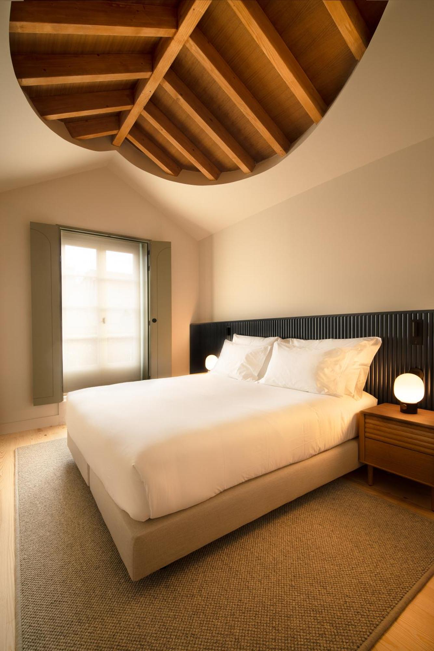 The Verse by João Luís Carrilho da Graça + Studio Astolfi — A bedroom in The Verse demonstrates the project's domestic-living approach through restrained materiality and considered proportions.