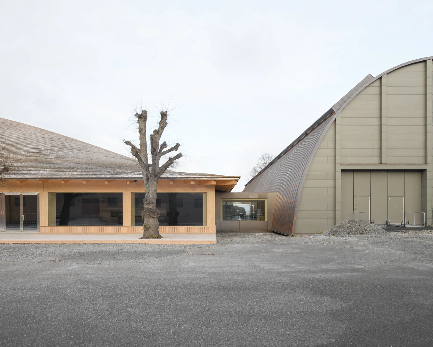 Wisdome Stockholm (National Museum of Science and Technology) by Elding Oscarson — The courtyard elevation presents a studied composition of material contrast: a timber-framed pavilion with brick infill and expansive glazing anchors the...