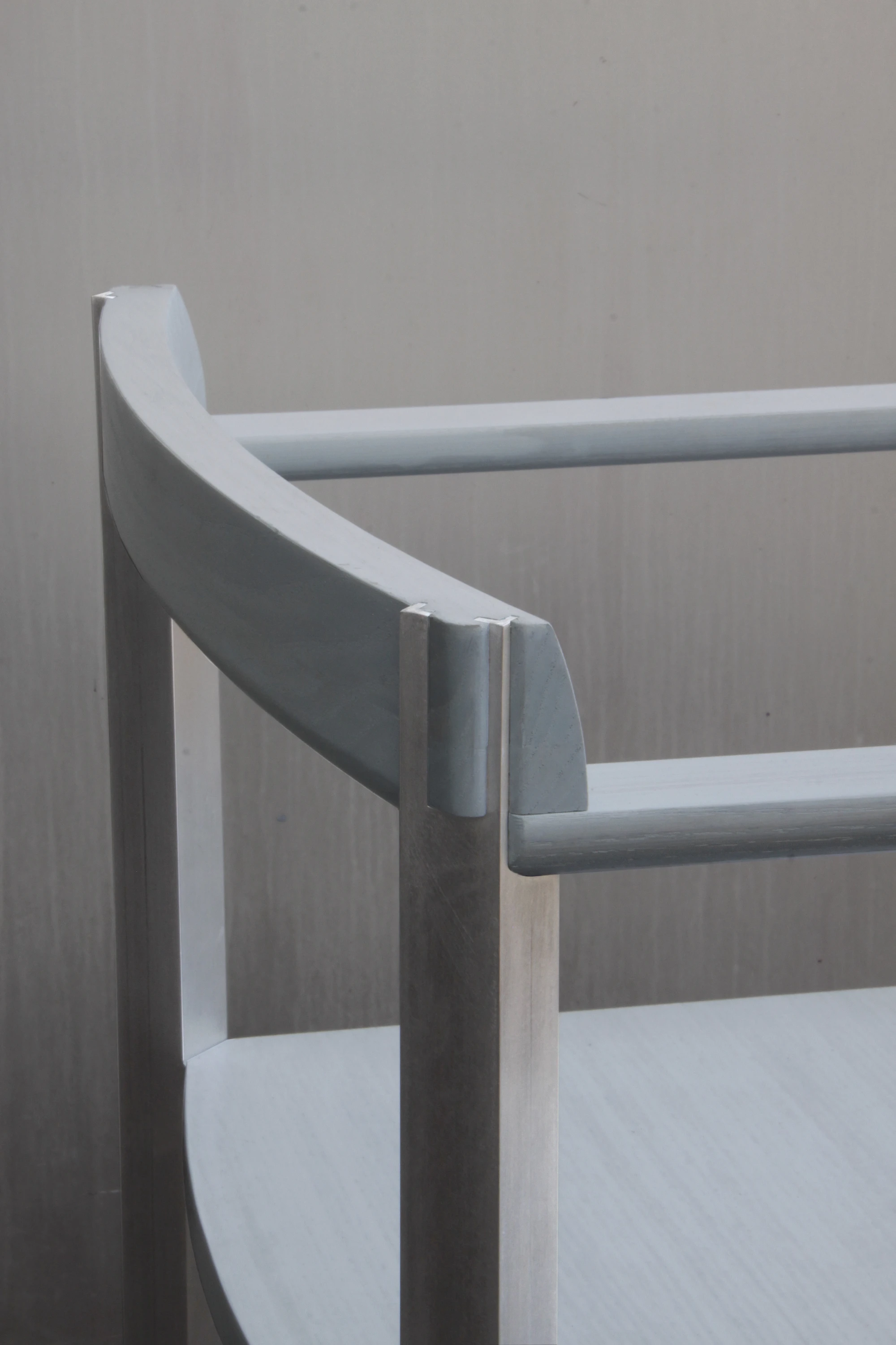 SQZY Chair by Timo Wuchner — Detail view isolating the joinery where backrest meets the horizontal rail, revealing the precision of construction.