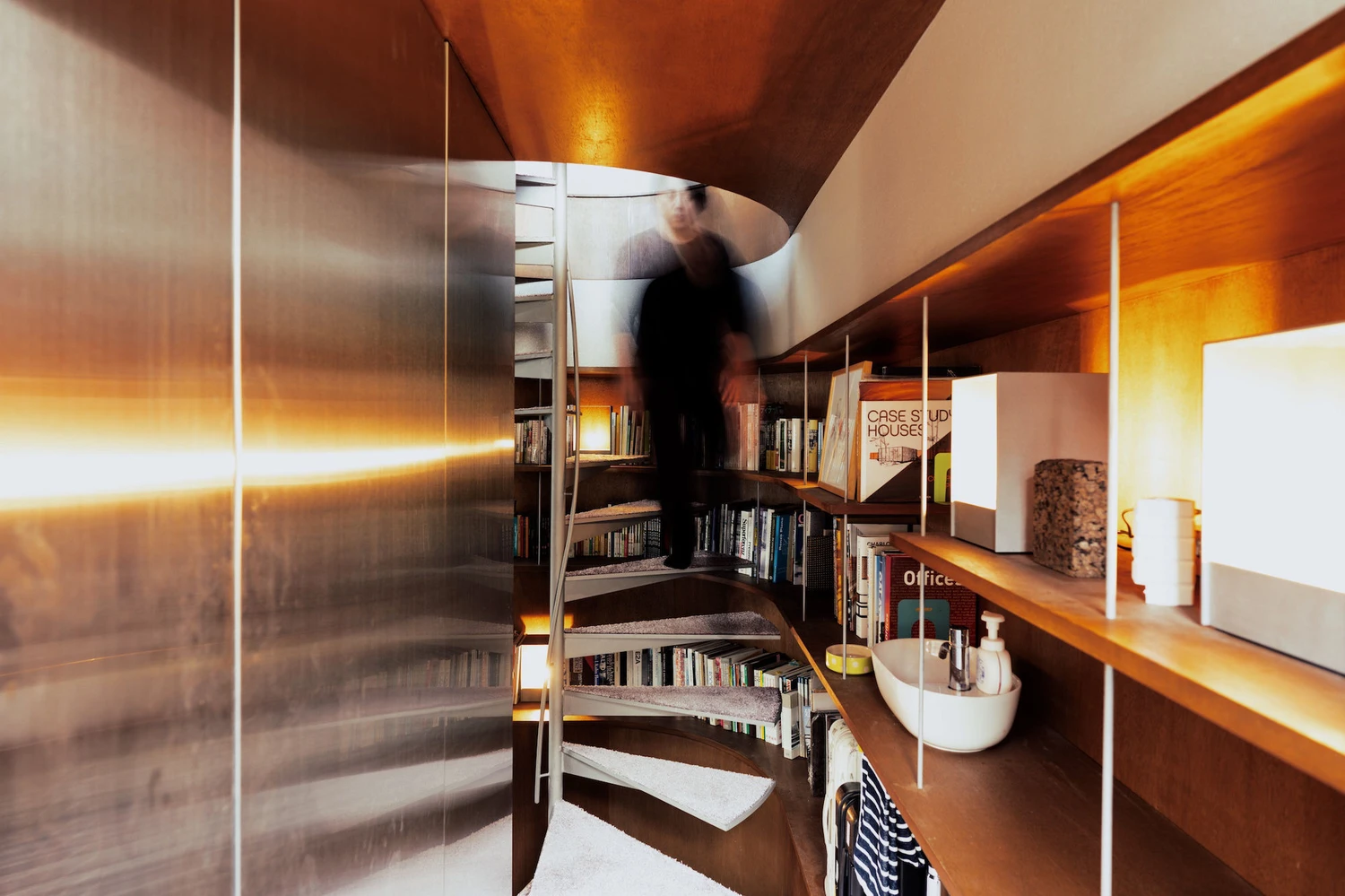 Bay Window Tower House by Takaaki Fuji + Yuko Fuji Architecture — Interior view of the Bay Window Tower House's stacked inhabitable ledges, captured mid-movement.