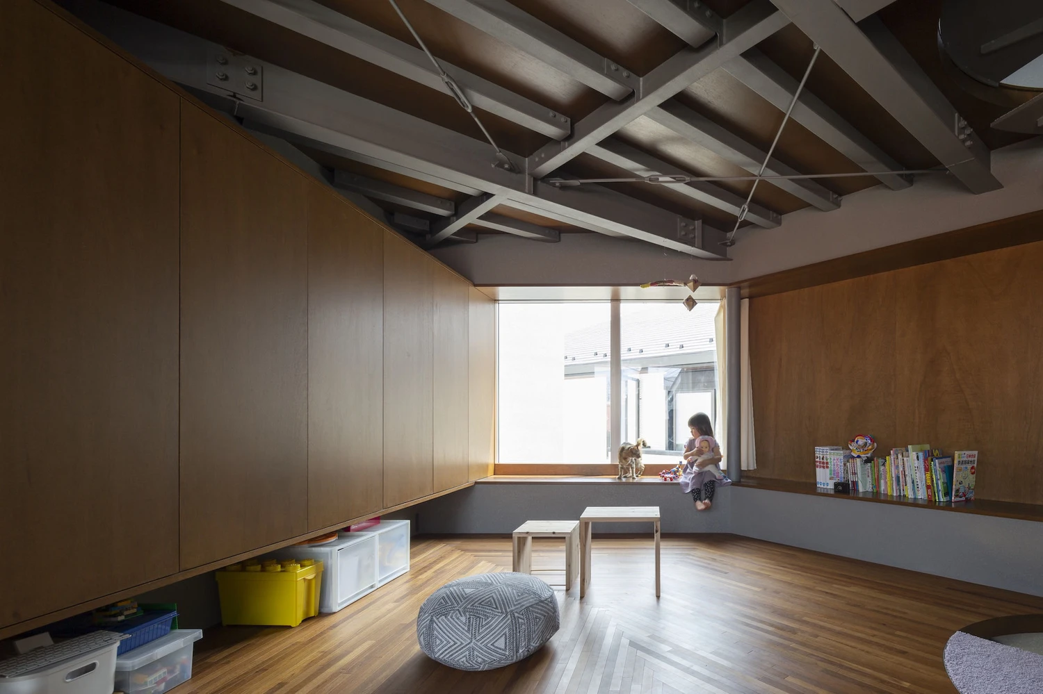 Bay Window Tower House by Takaaki Fuji + Yuko Fuji Architecture — Interior view of a children's playroom within the bay window tower, captured from a low vantage point near floor level.