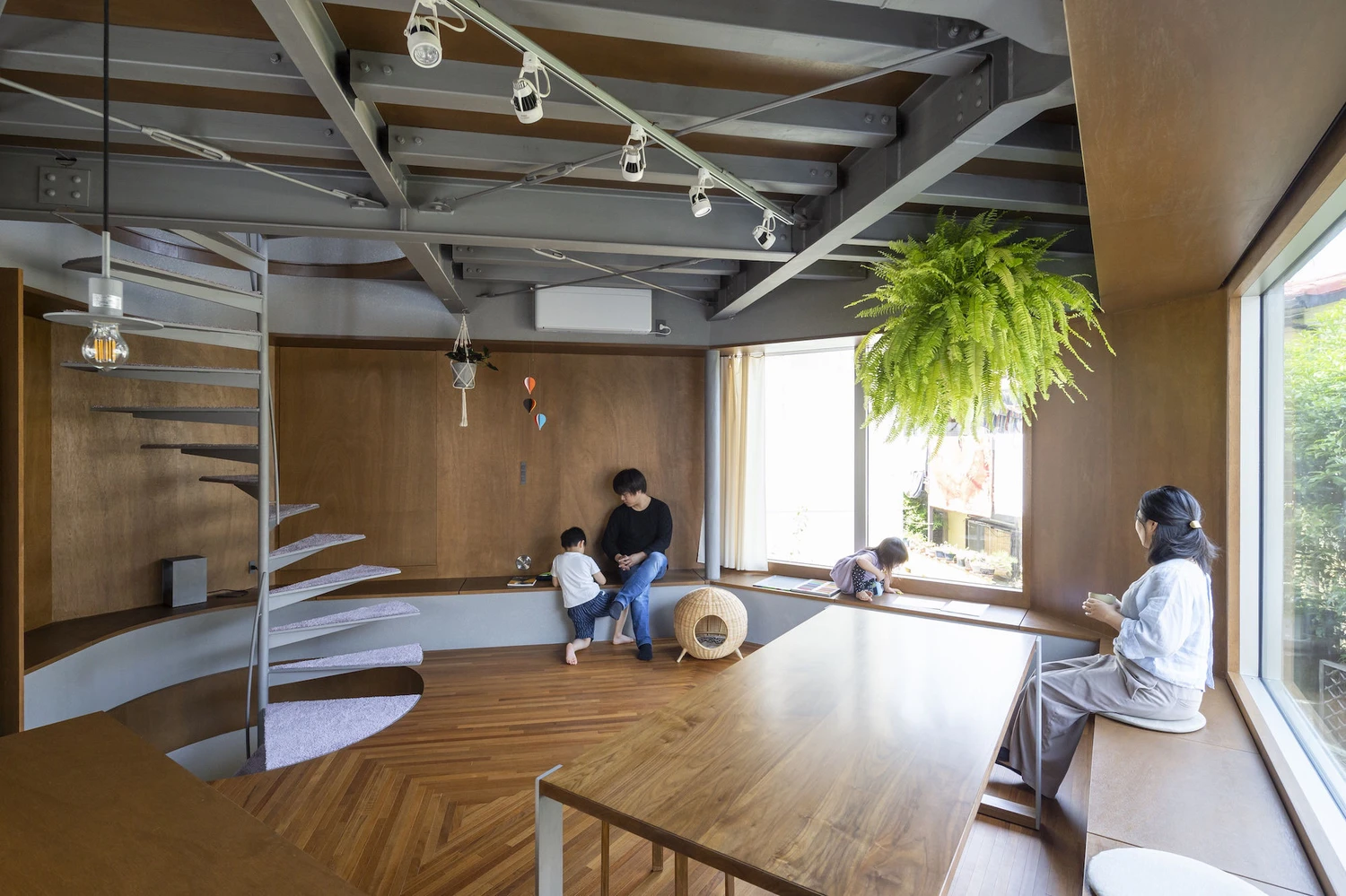 Bay Window Tower House by Takaaki Fuji + Yuko Fuji Architecture — Interior view of the stacked bay window strategy, revealing the inhabited ledges as functional living surfaces.