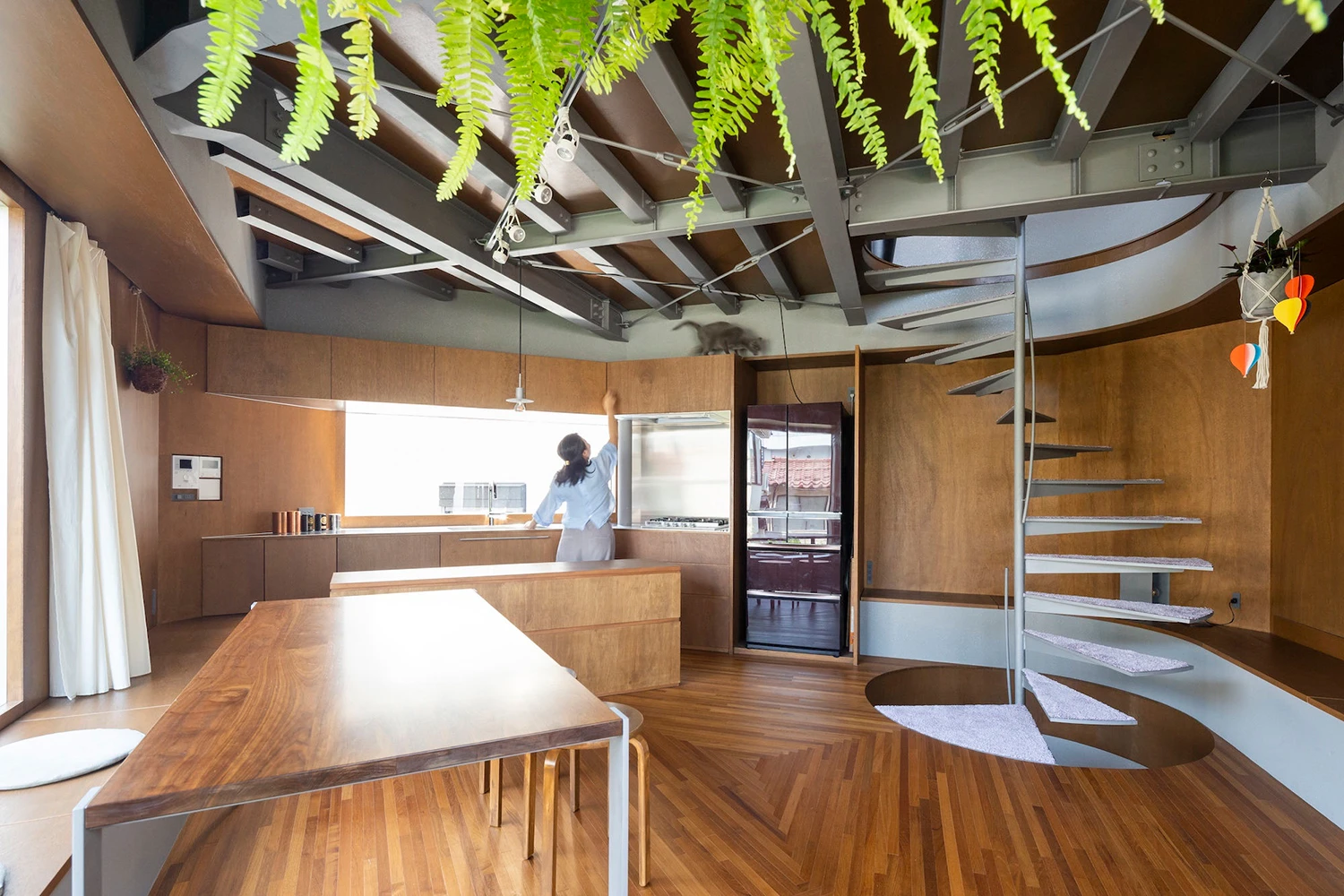Bay Window Tower House by Takaaki Fuji + Yuko Fuji Architecture — Interior view of the Bay Window Tower House showcasing the inhabitable ledge strategy.