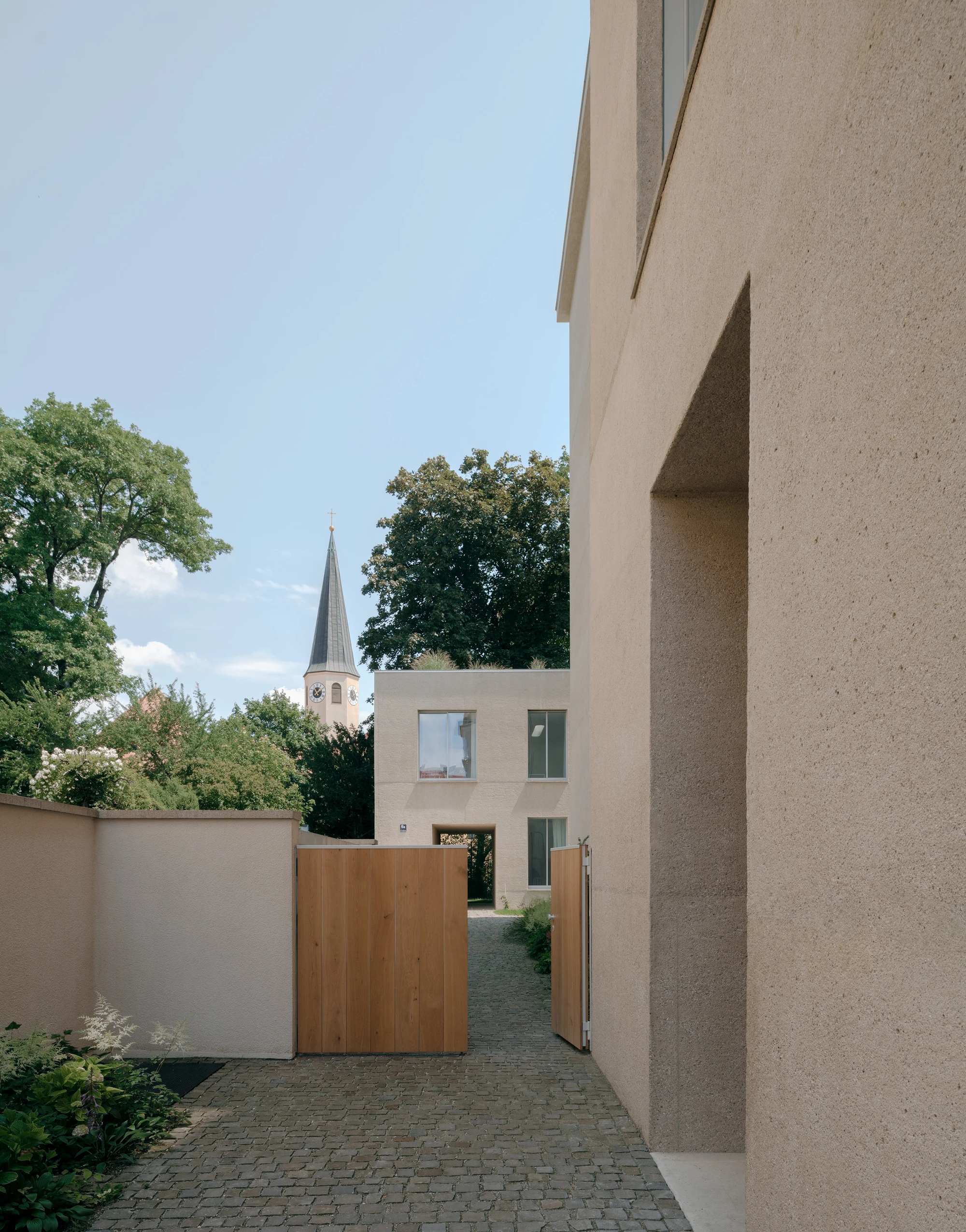 Ursulastraße 6 by Studio Mark Randel — The entrance passage frames a threshold between public street and private residence.