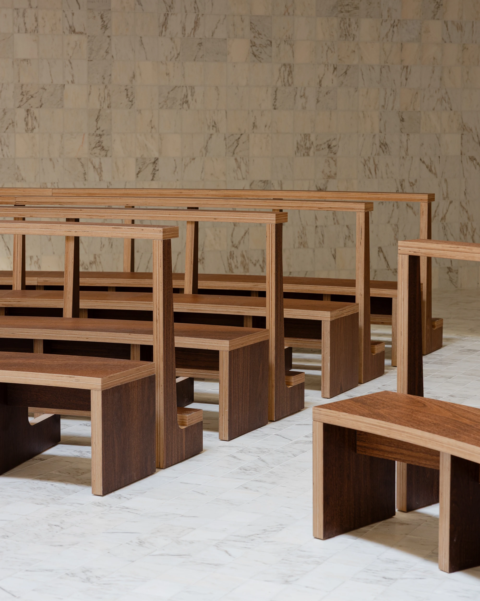 Da Boavista Church by Matos Gameiro arquitectos + atelier bugio — Interior view of Da Boavista Church revealing the timber seating arrangement in receding rows.